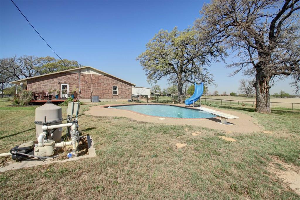 3559 Springfield Road Springtown, TX 76082 - Photo 18 of 37 a view of a house with yard and sitting area