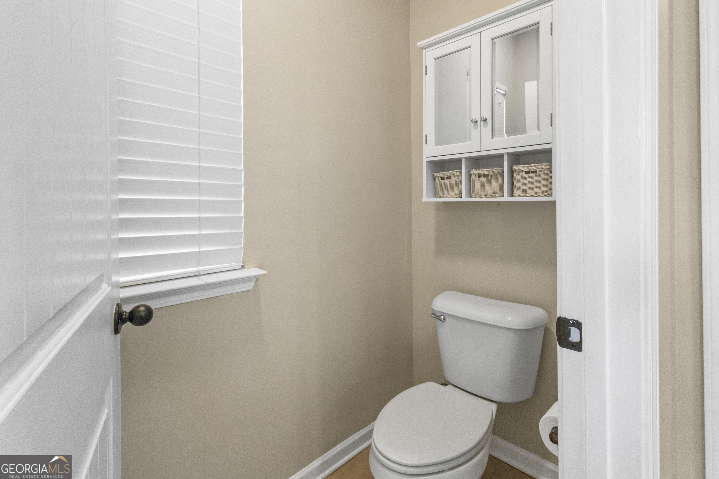 100 Wet Stone Road Senoia, GA 30276 - Photo 19 of 54 a white toilet sitting next to a shower