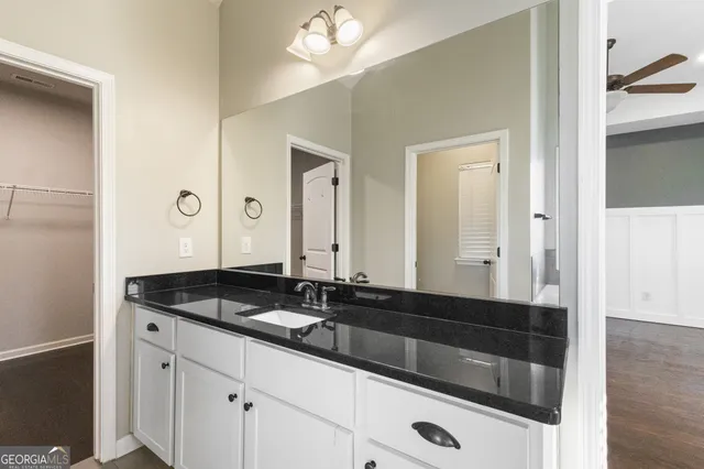 a kitchen with kitchen island a large window in it