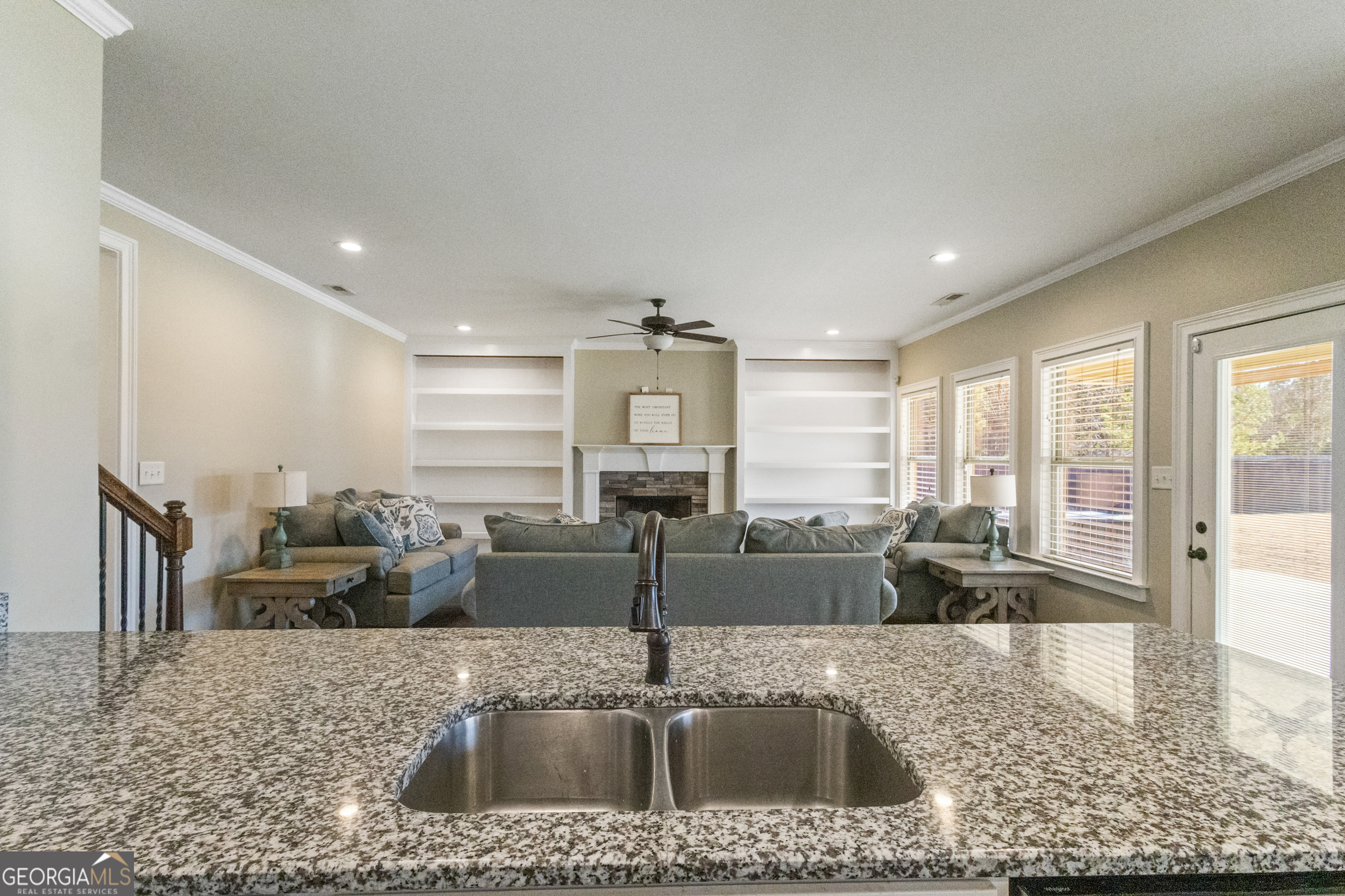 100 Wet Stone Road Senoia, GA 30276 - Photo 26 of 54 a kitchen with kitchen island a large window in it