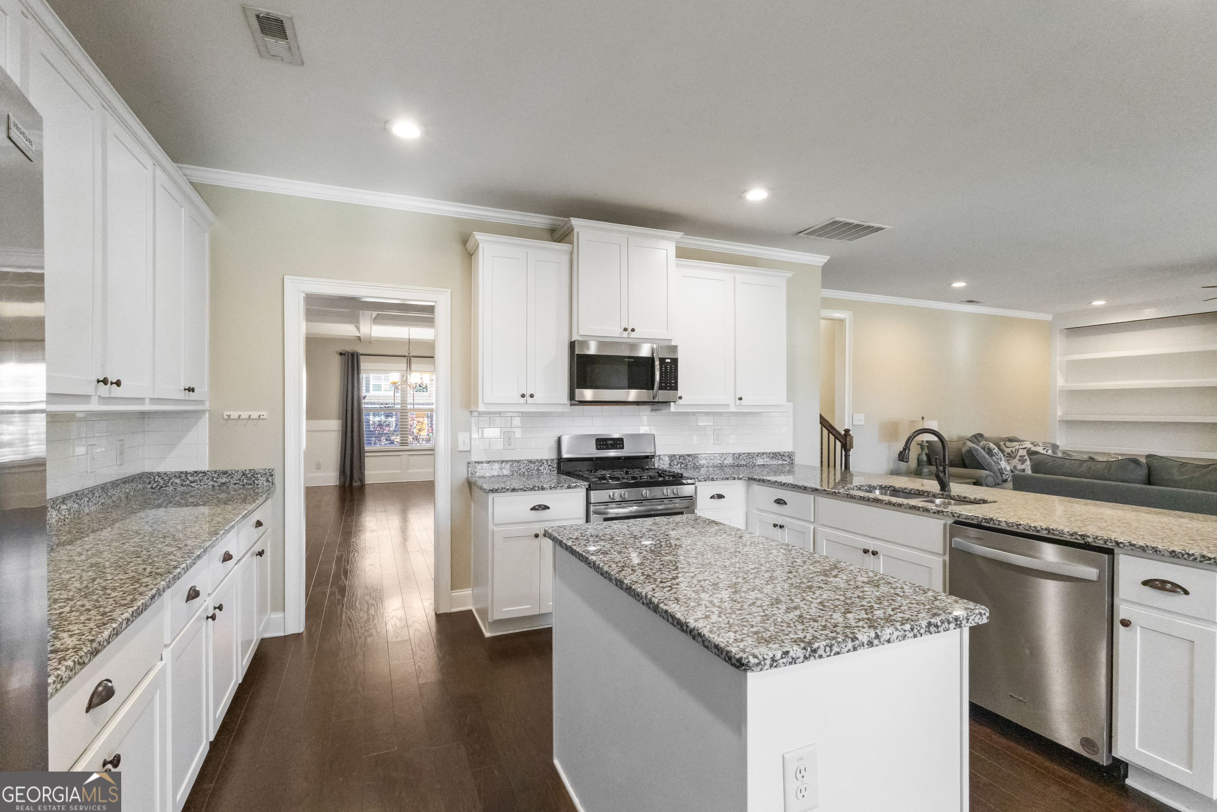 100 Wet Stone Road Senoia, GA 30276 - Photo 27 of 54 a kitchen with stainless steel appliances granite countertop a sink stove and refrigerator