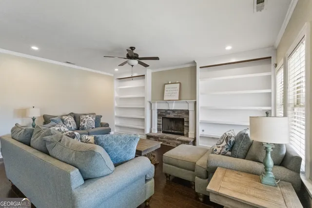 a view of a hallway with wooden floor and entryway