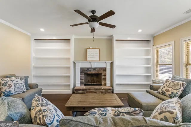 a bathroom with a granite countertop shower sink vanity mirror and toilet