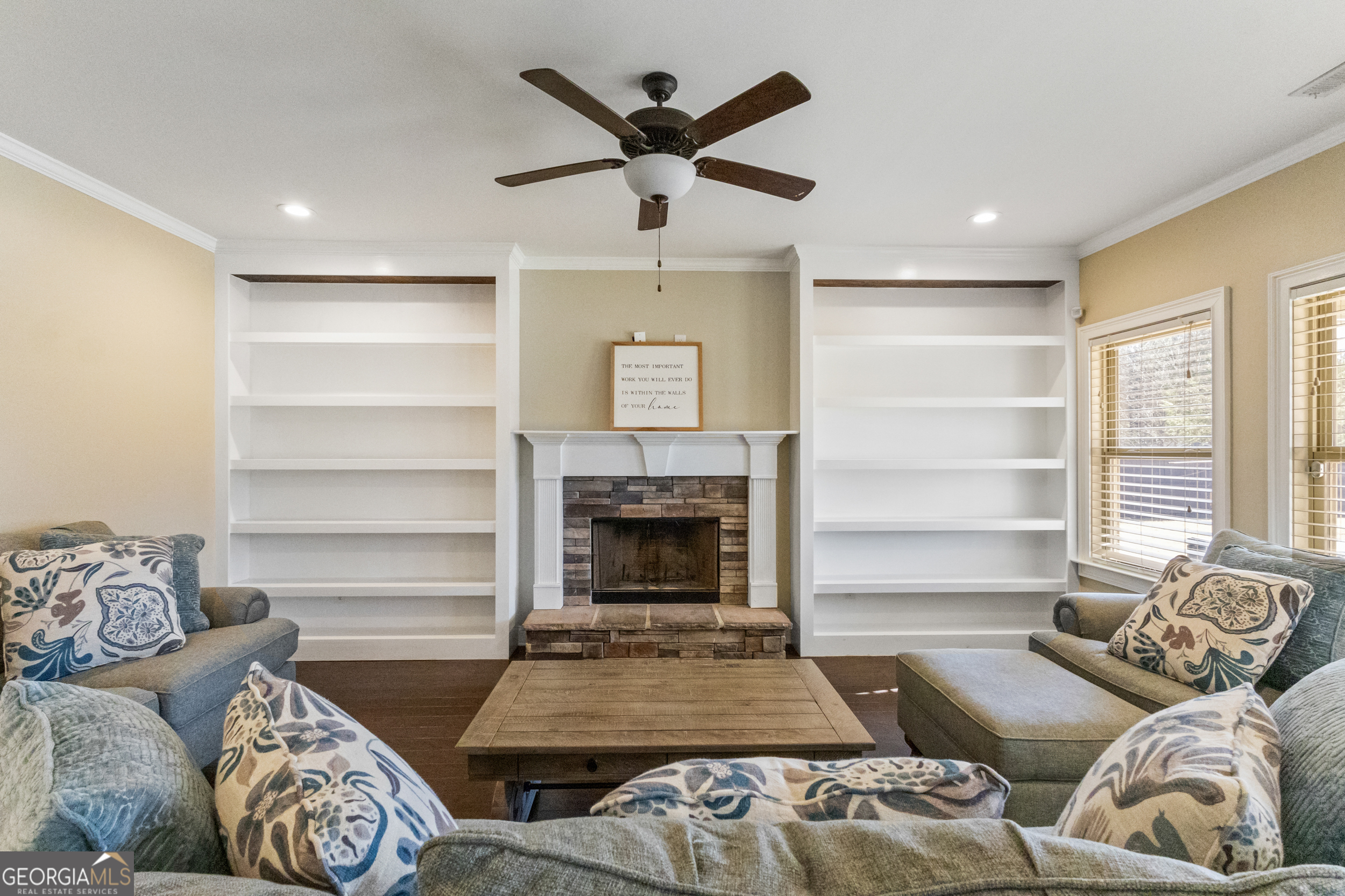 100 Wet Stone Road Senoia, GA 30276 - Photo 32 of 54 a living room with furniture and a fireplace