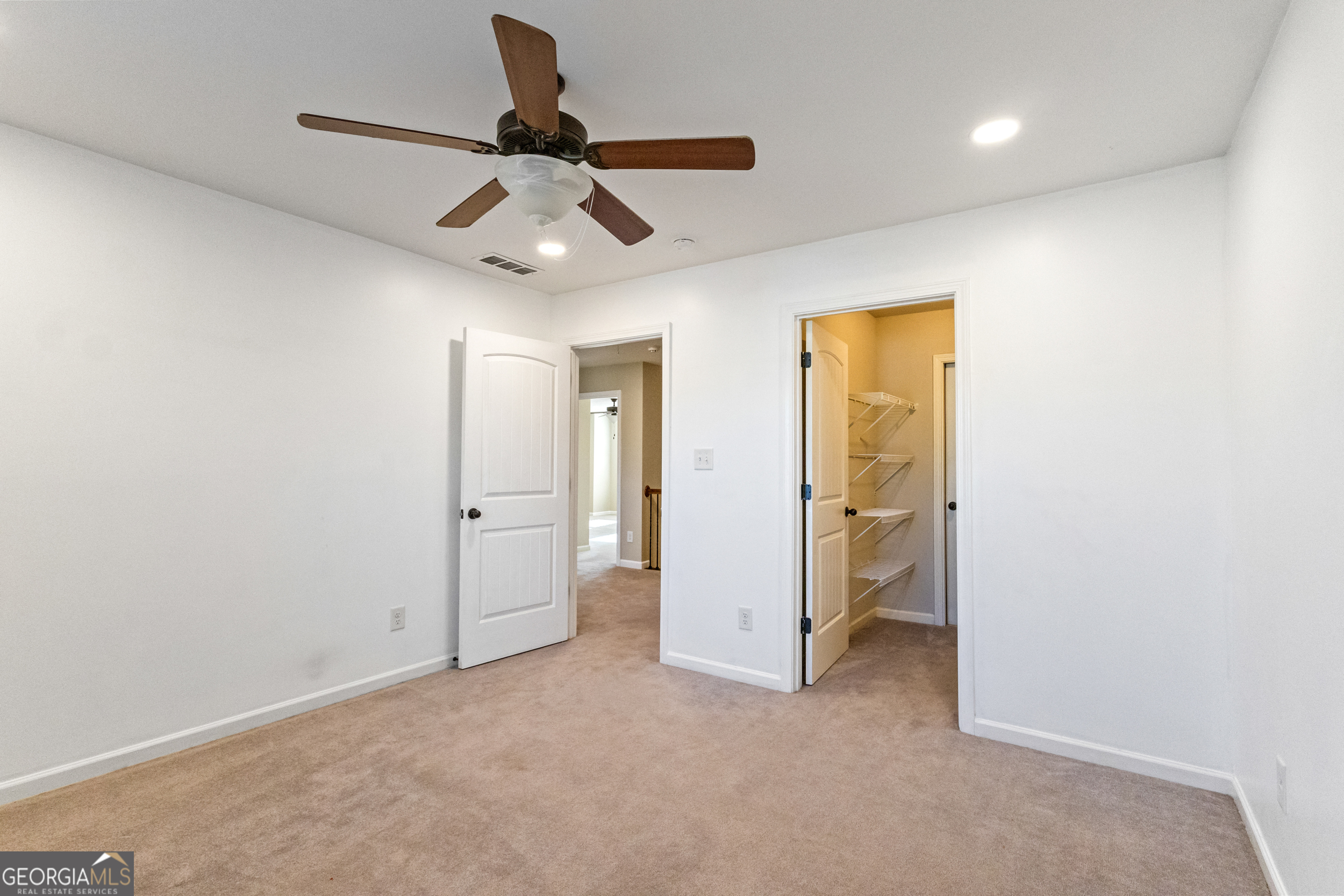 100 Wet Stone Road Senoia, GA 30276 - Photo 41 of 54 a view of a hallway with a ceiling fan