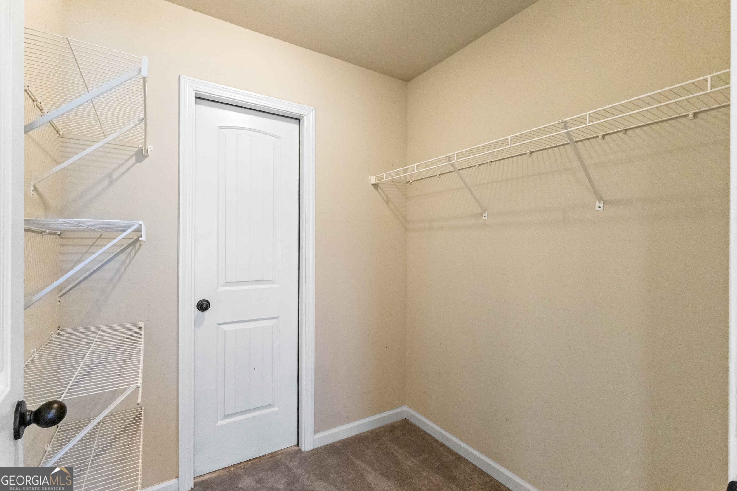 100 Wet Stone Road Senoia, GA 30276 - Photo 42 of 54 a view of a room with racks on the wall