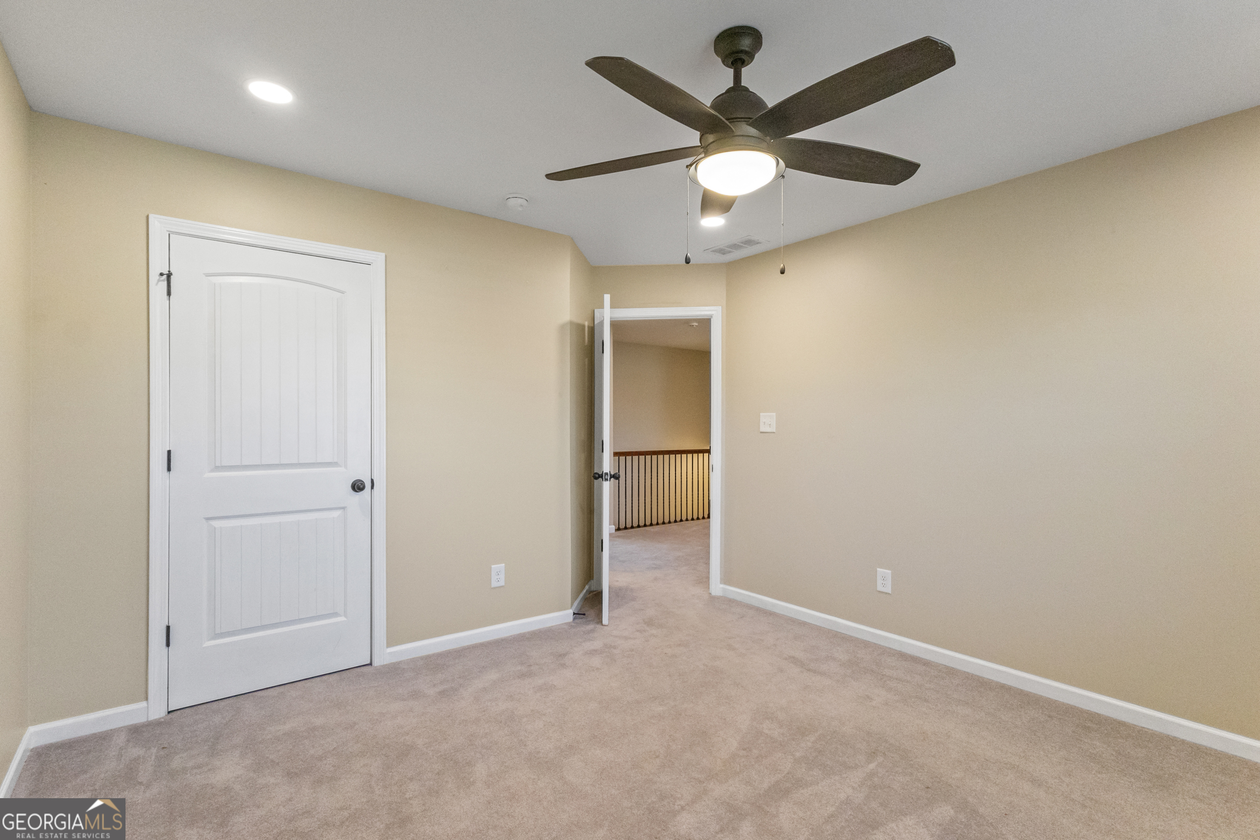100 Wet Stone Road Senoia, GA 30276 - Photo 44 of 54 an empty room with a ceiling fan and a bathroom
