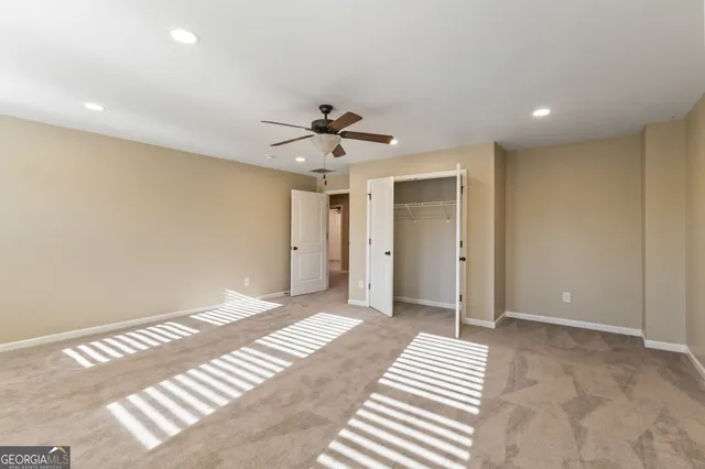 a view of living room with furniture and a large window