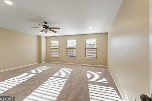 a view of a dry yard with a house