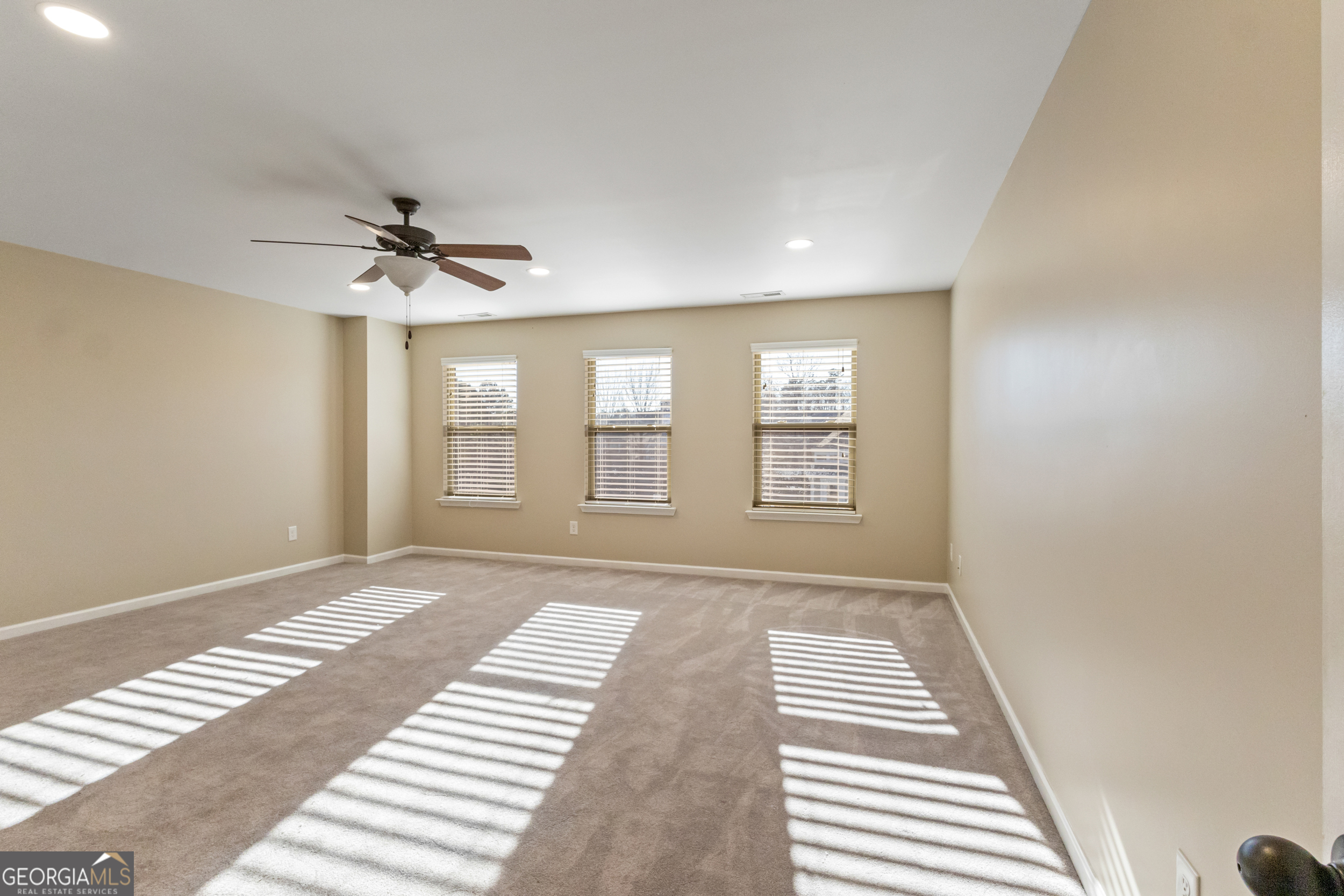 100 Wet Stone Road Senoia, GA 30276 - Photo 47 of 54 a view of an empty room with a window and a kitchen