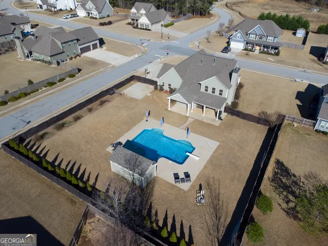an empty room with wooden floor and a floor to ceiling window