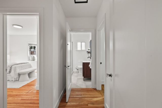 a view of a bathroom from a hallway