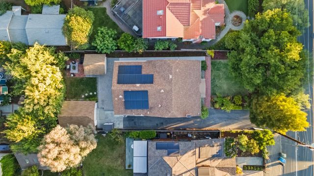 an aerial view of house with yard swimming pool and outdoor seating