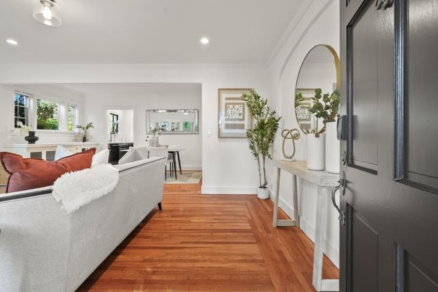 a living room with furniture and a rug