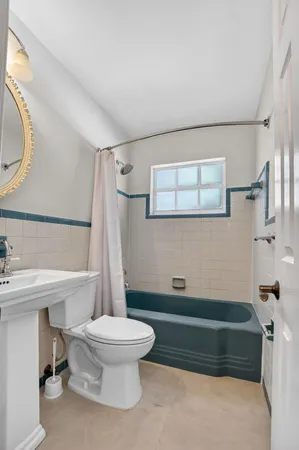 a bathroom with a sink a toilet and a bathtub