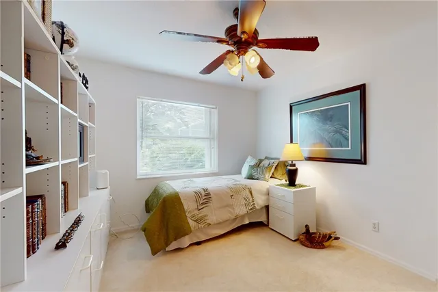 a bed room with a bed and a window