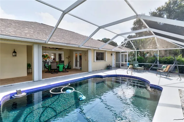 a view of a swimming pool with a patio