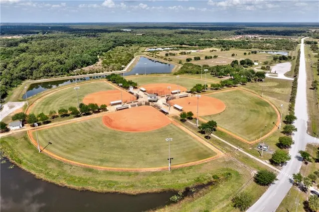 a view of a playground with a garden