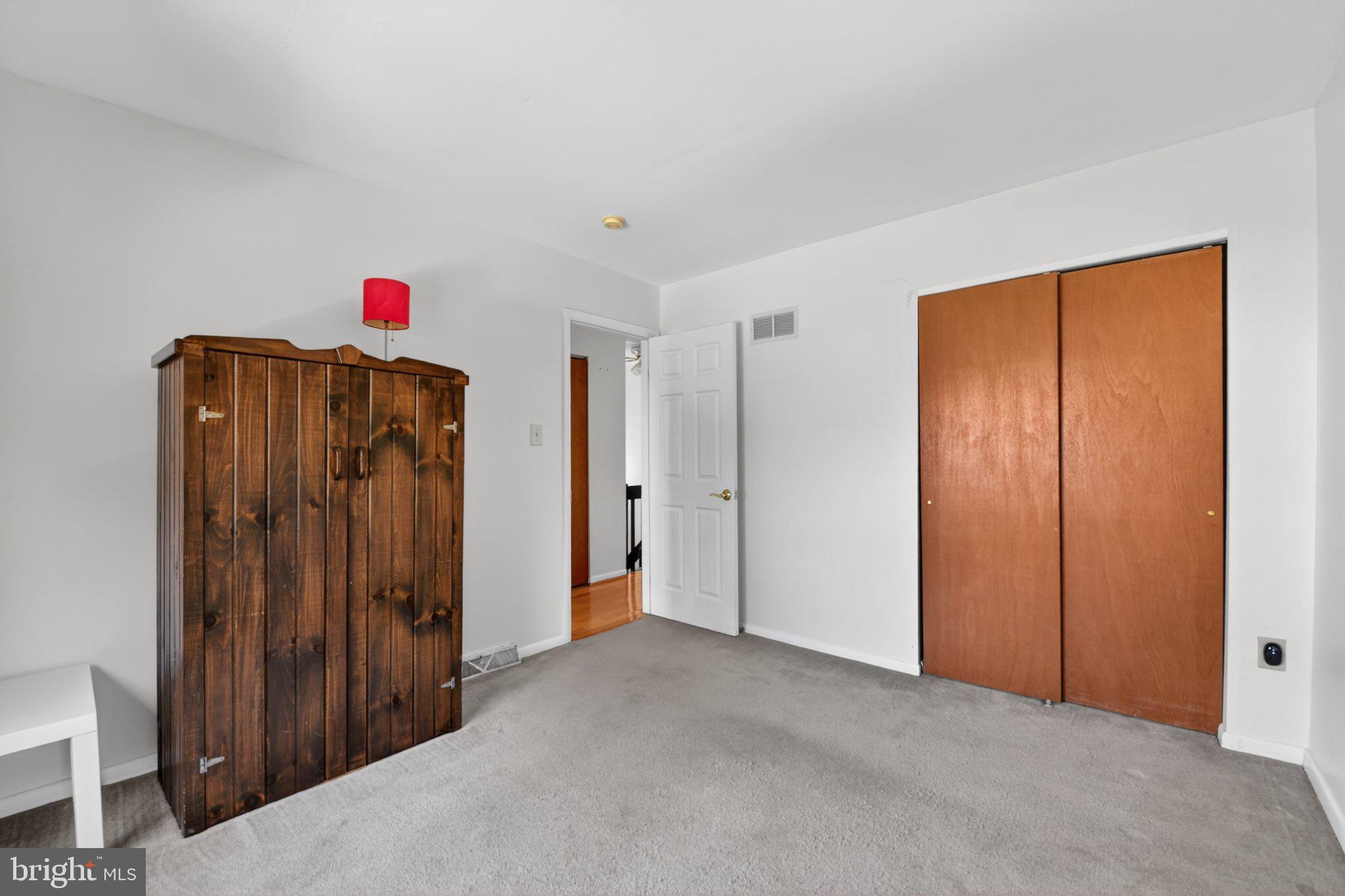 69-4 Azalea Way Reading, PA 19606 - Photo 26 of 34 Spacious room with warm wooden accents.