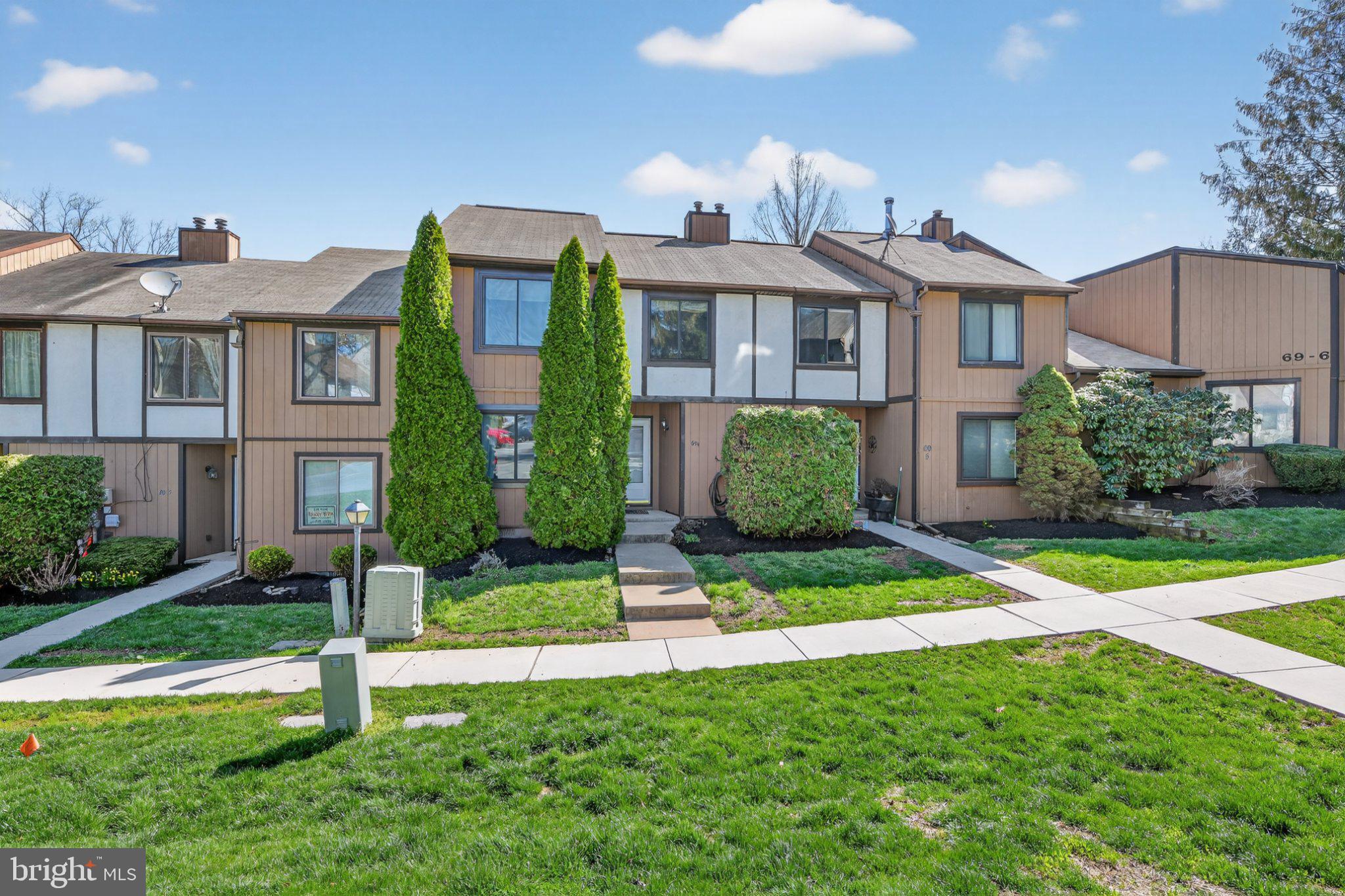 69-4 Azalea Way Reading, PA 19606 - Photo 3 of 34 Charming townhome with lush greenery.