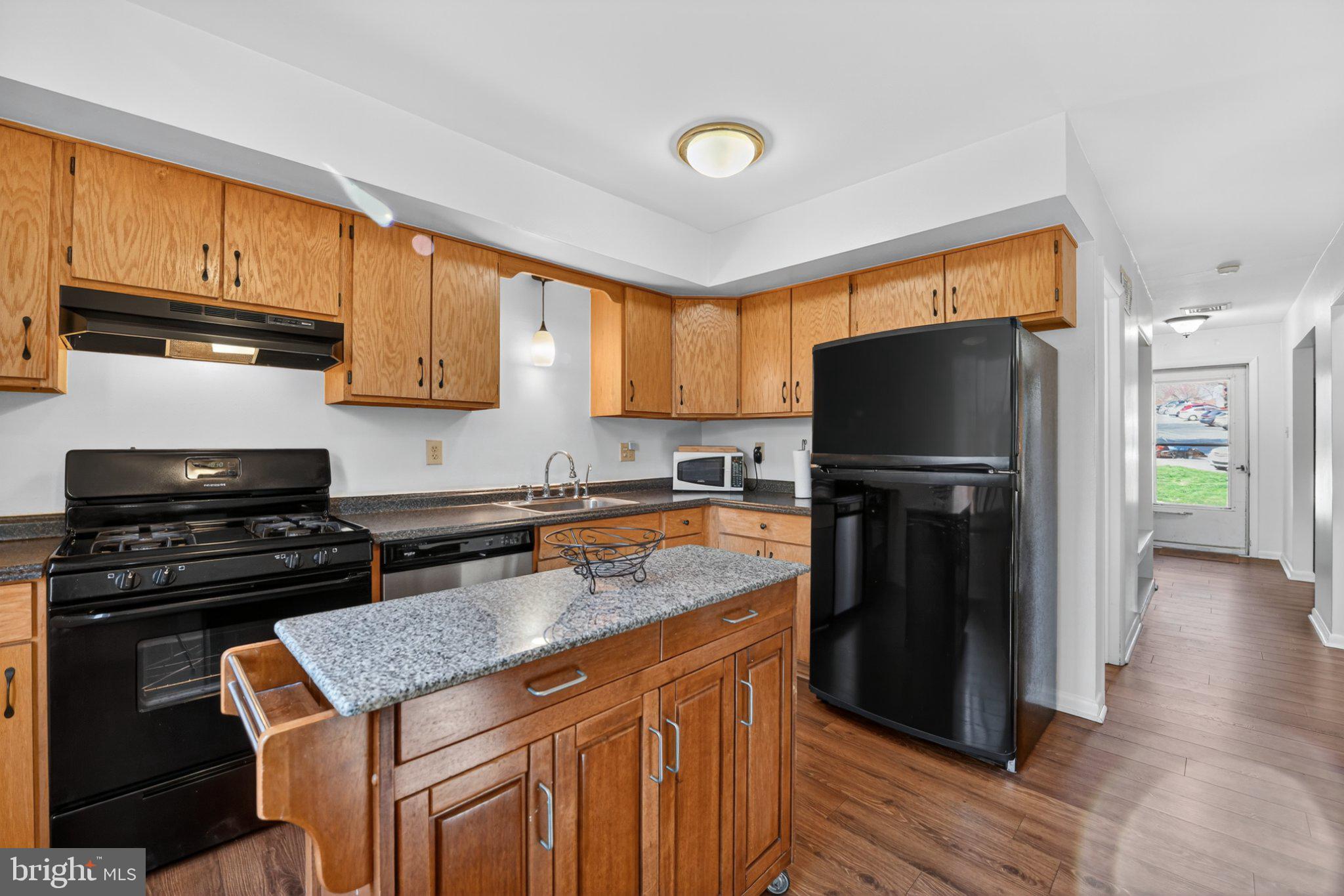69-4 Azalea Way Reading, PA 19606 - Photo 8 of 34 Modern kitchen with warm wood accents.