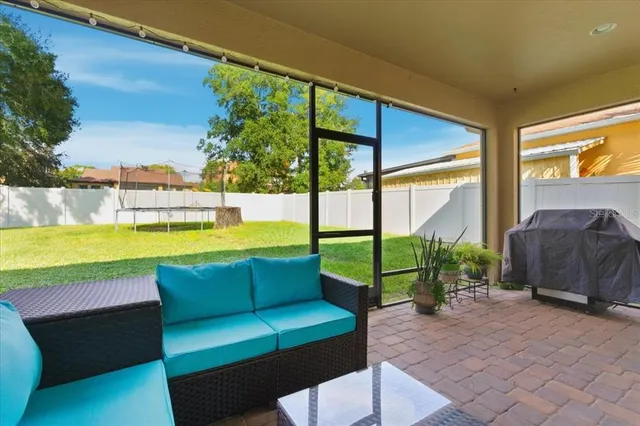a view of swimming pool with seating area and furniture