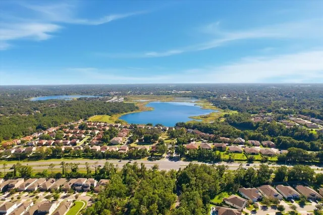 an aerial view of residential building and lake