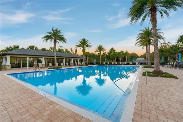 a view of a swimming pool with a patio
