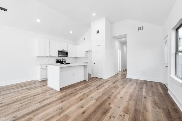 a view of kitchen with wooden floor