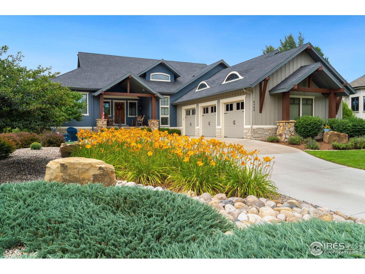6568 Rookery Road Fort Collins, CO 80528 - Photo 2 of 16 a front view of a house with a yard