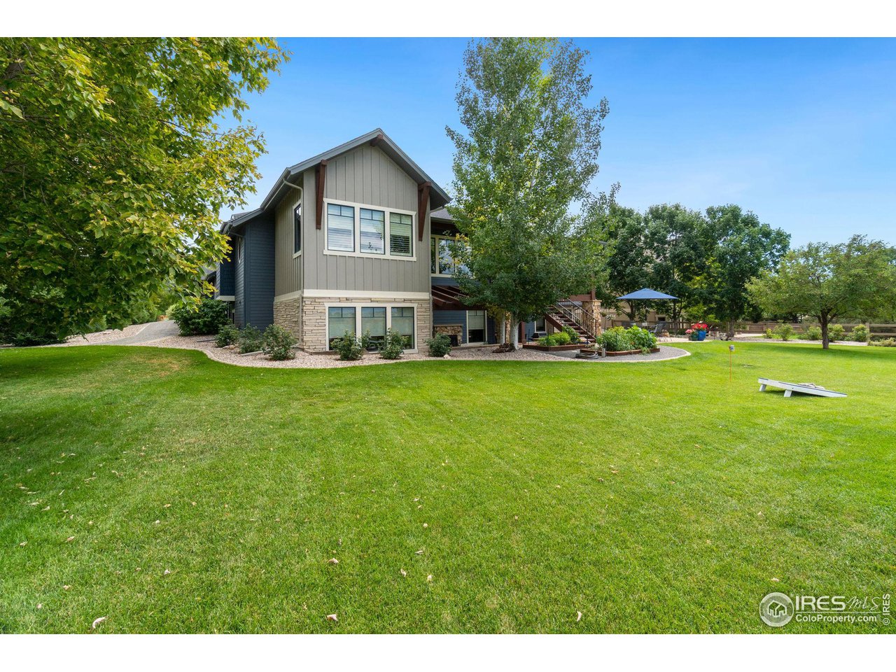 6568 Rookery Road Fort Collins, CO 80528 - Photo 5 of 16 a view of a house with a big yard