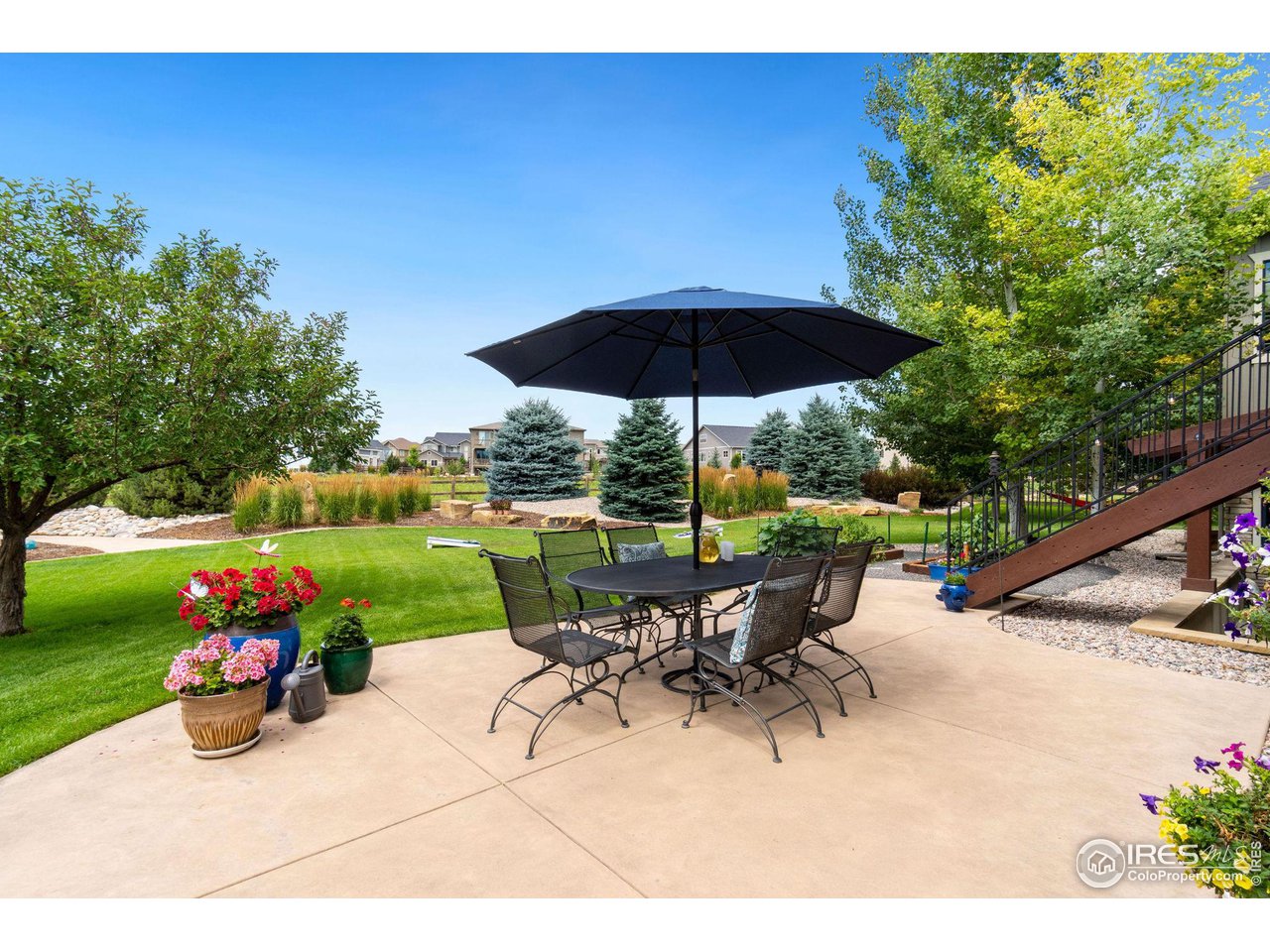 6568 Rookery Road Fort Collins, CO 80528 - Photo 6 of 16 a view of a backyard with sitting area and furniture
