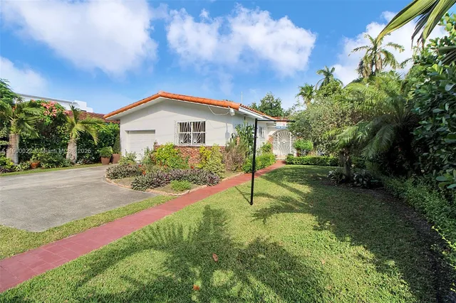 a house view with a garden space