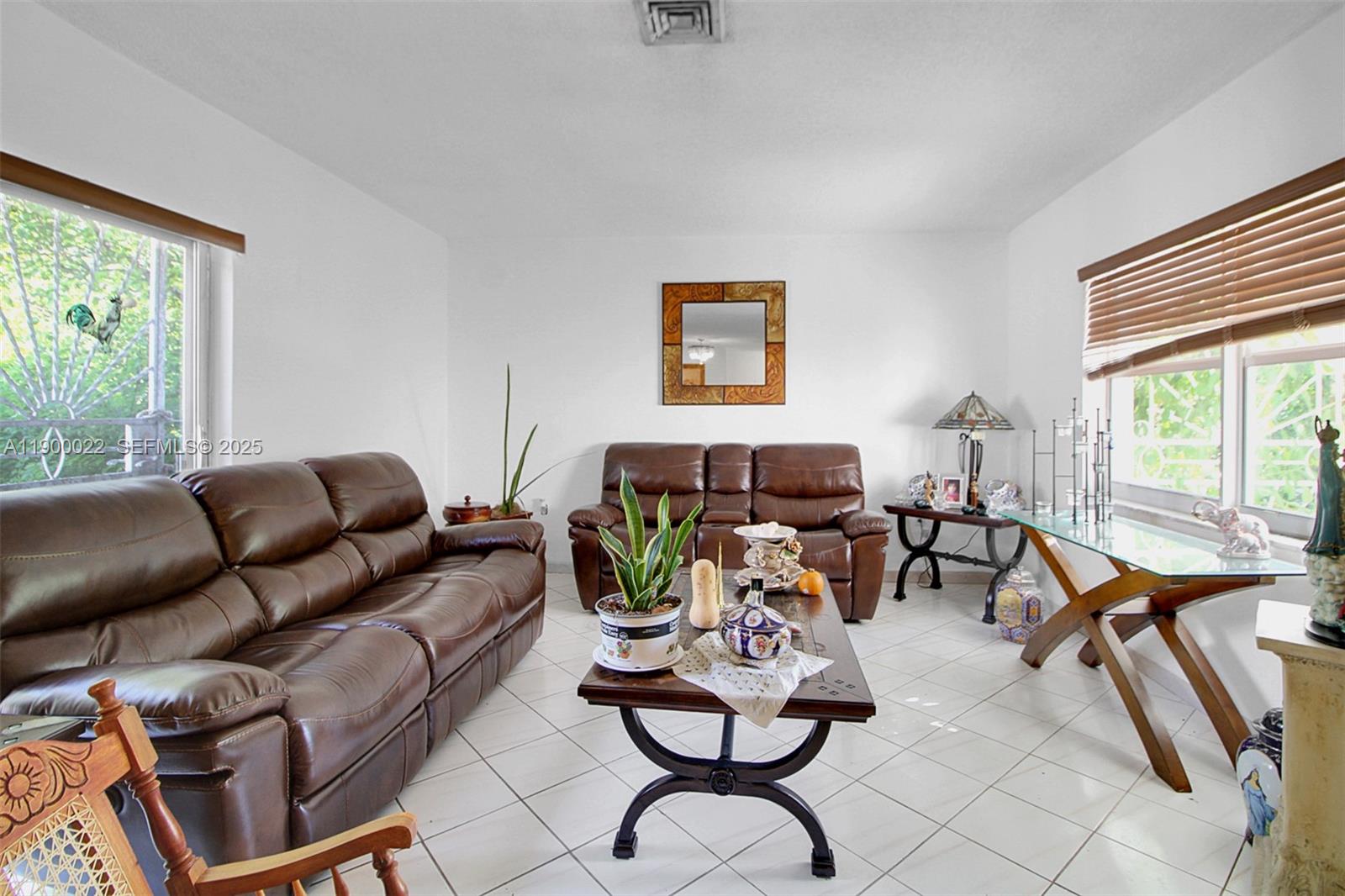2711 Red Road Coral Gables, FL 33134 - Photo 22 of 33 a living room with furniture and a window