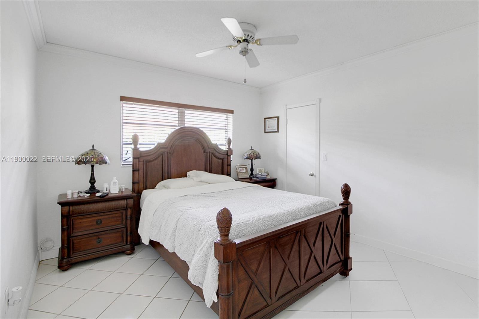 2711 Red Road Coral Gables, FL 33134 - Photo 24 of 33 a bedroom with a bed table and window