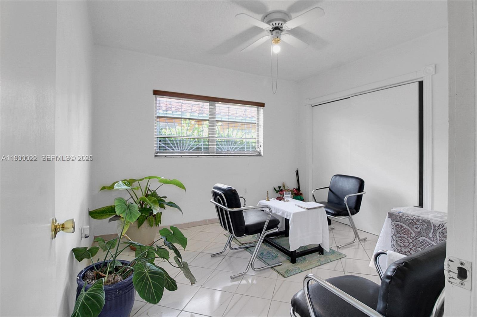2711 Red Road Coral Gables, FL 33134 - Photo 29 of 33 a living room with furniture and a potted plant
