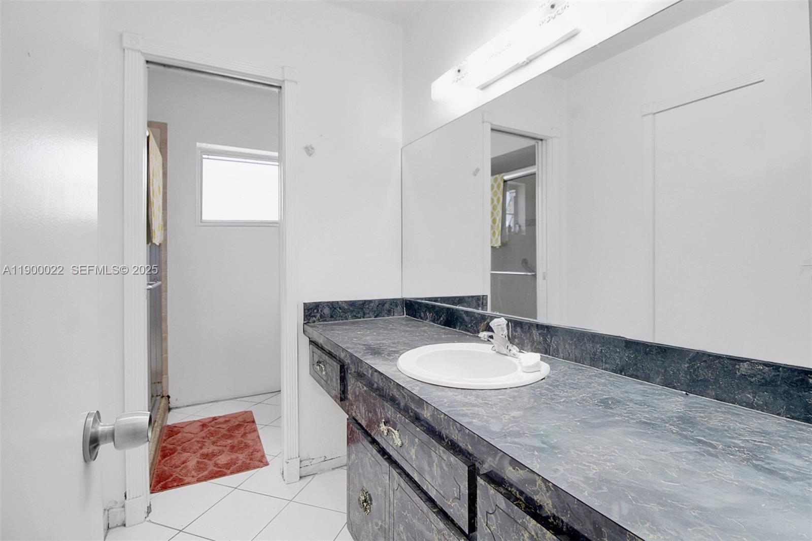 2711 Red Road Coral Gables, FL 33134 - Photo 30 of 33 a sink and a mirror