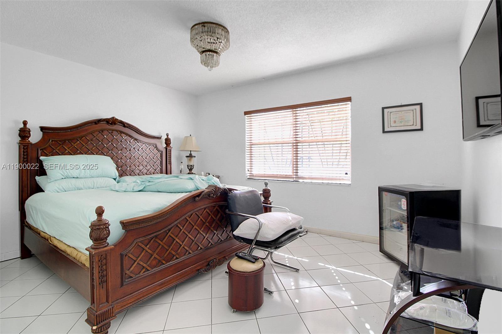 2711 Red Road Coral Gables, FL 33134 - Photo 31 of 33 a bedroom with a bed and window