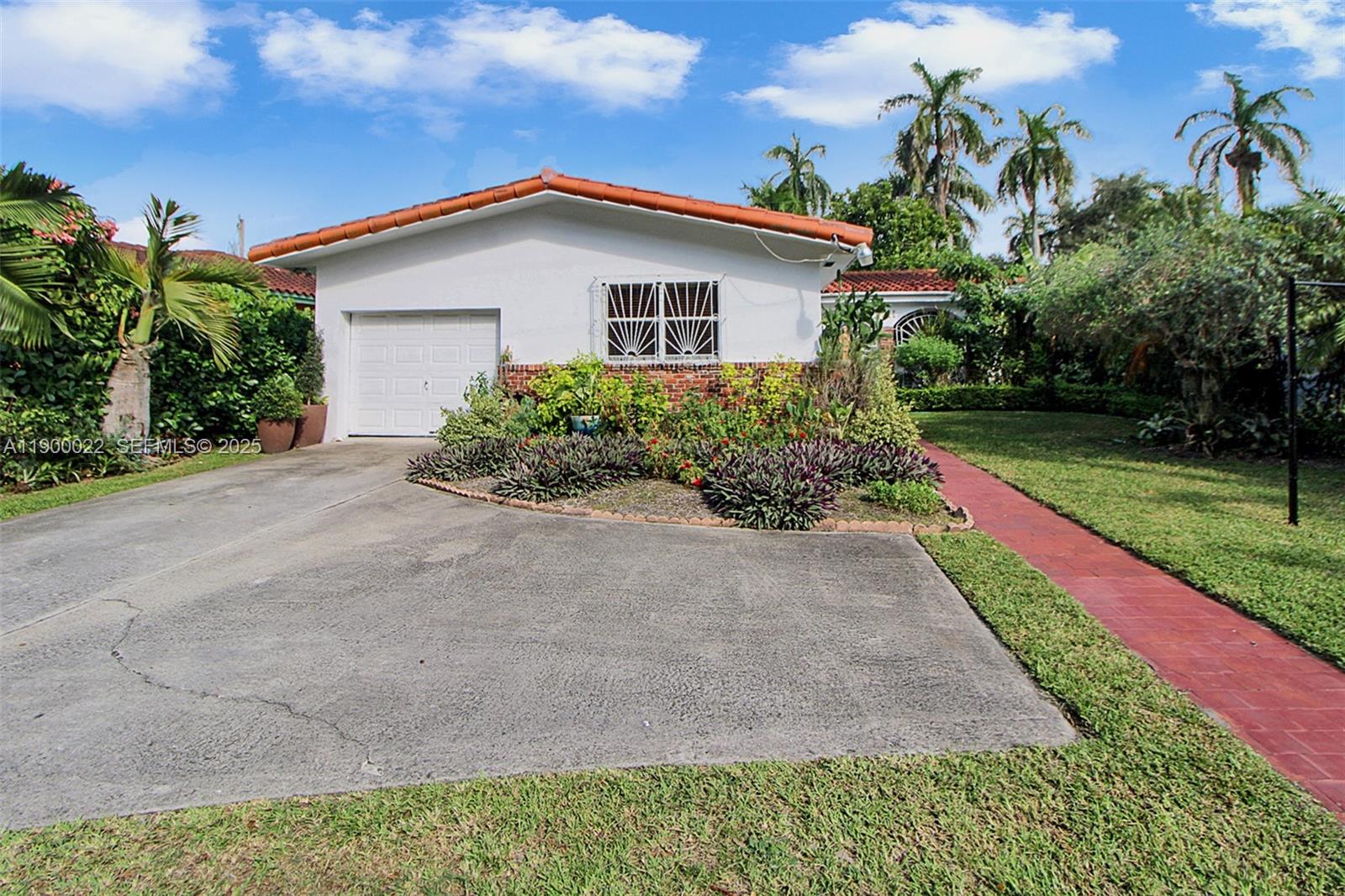 2711 Red Road Coral Gables, FL 33134 - Photo 8 of 33 a front view of house with yard and green space