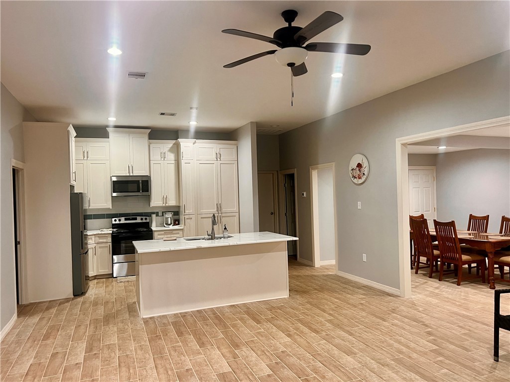159 Lcr 904 Jewett, TX 75846 - Photo 3 of 20 a large white kitchen with a large window stainless steel appliances and cabinets