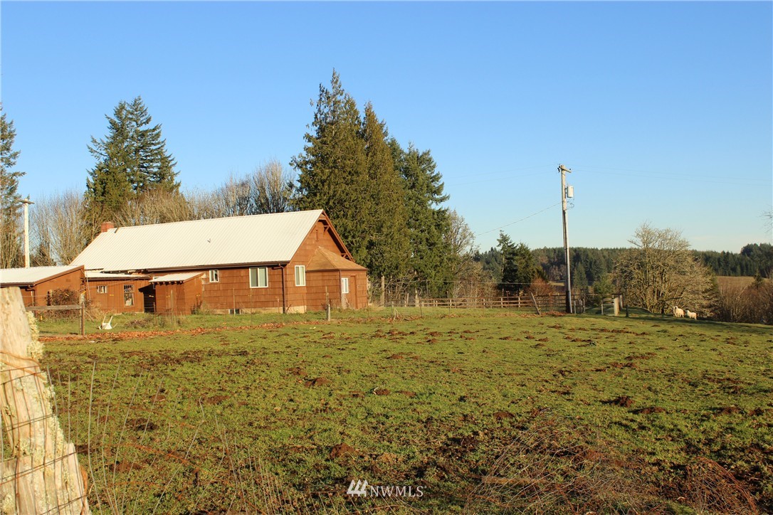 13310 201st Avenue Southwest Rochester, WA 98579 - Photo 22 of 25 a view of a house with a yard