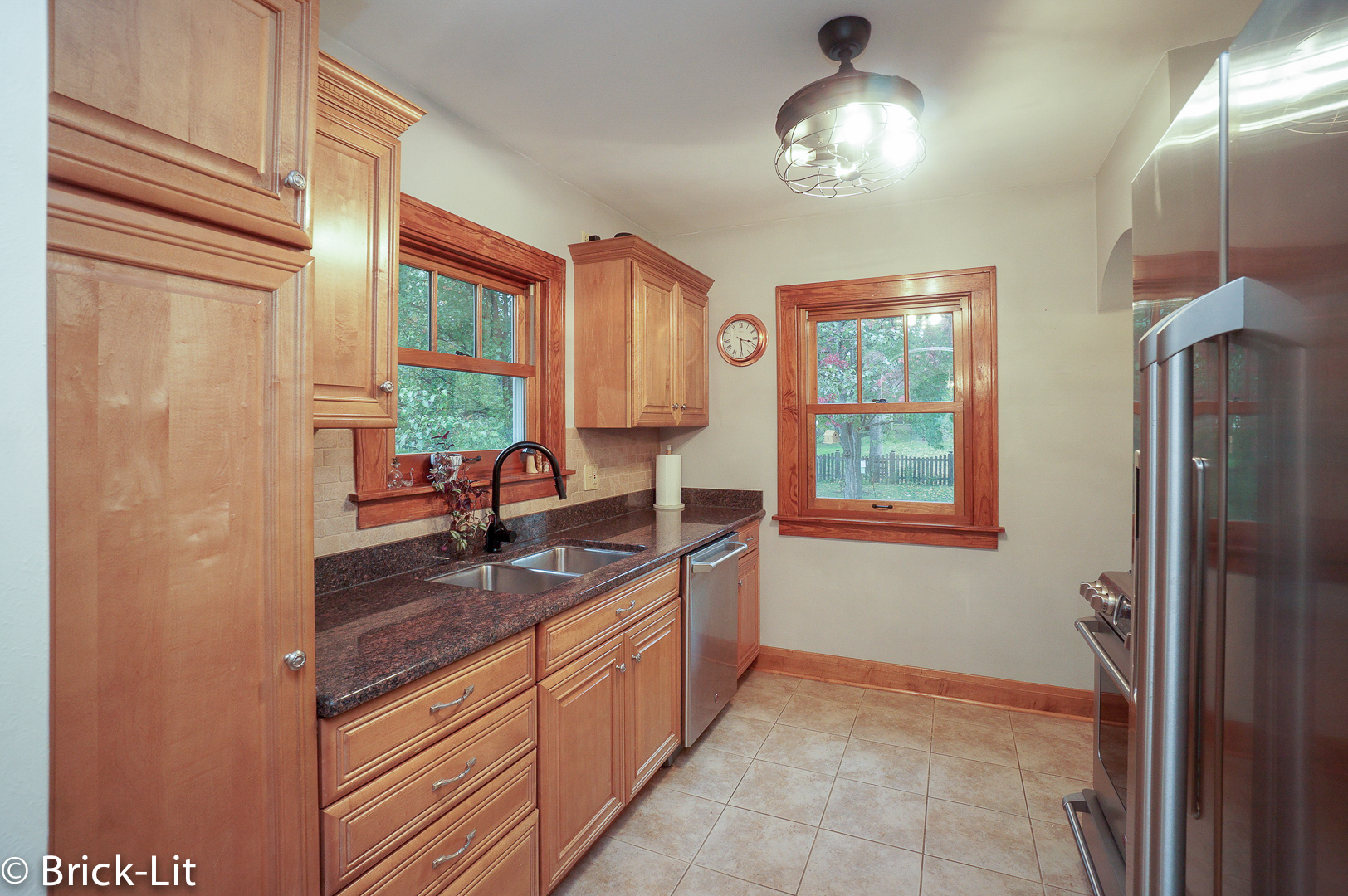 211 Gum Street New Lenox, IL 60451 - Photo 11 of 23 a kitchen with granite countertop cabinets and window