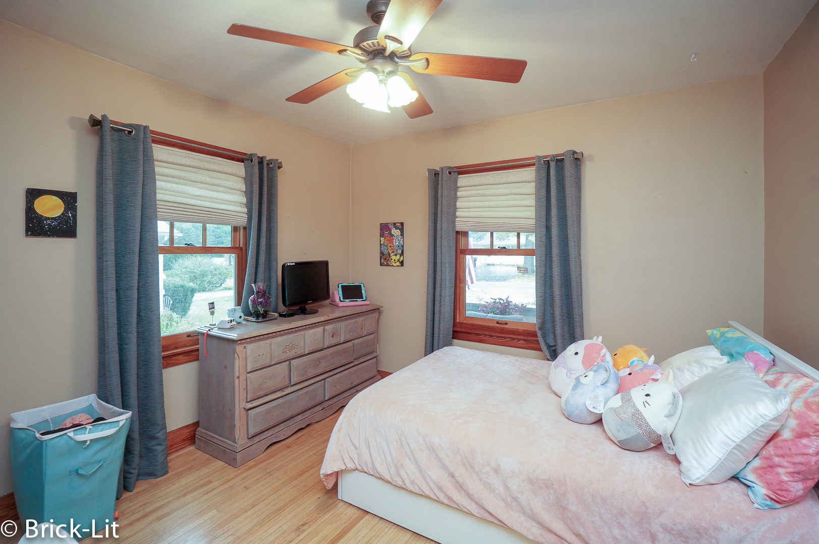 211 Gum Street New Lenox, IL 60451 - Photo 12 of 23 a bedroom with a bed and a chandelier