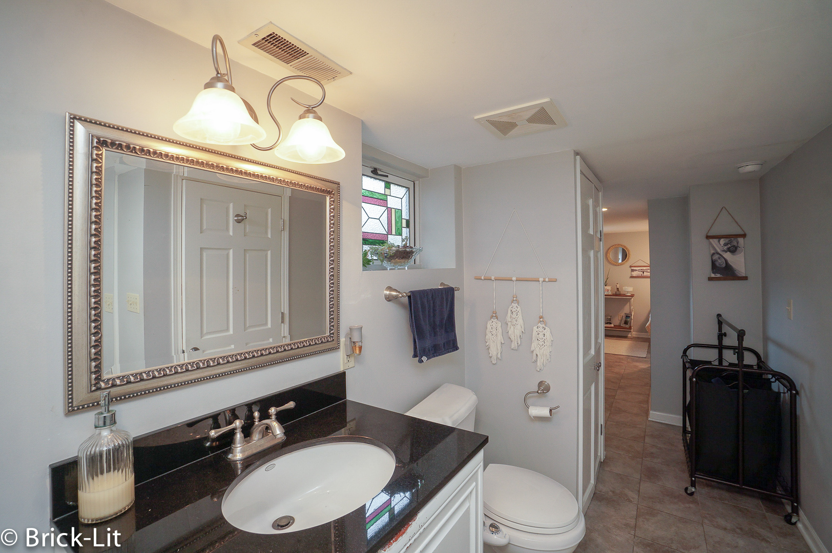 211 Gum Street New Lenox, IL 60451 - Photo 19 of 23 a bathroom with a toilet a sink and mirror