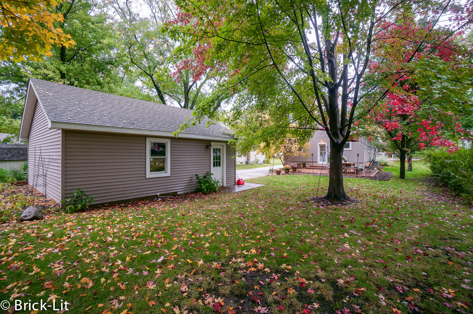 211 Gum Street New Lenox, IL 60451 - Photo 22 of 23 a backyard of a house with plants and large tree