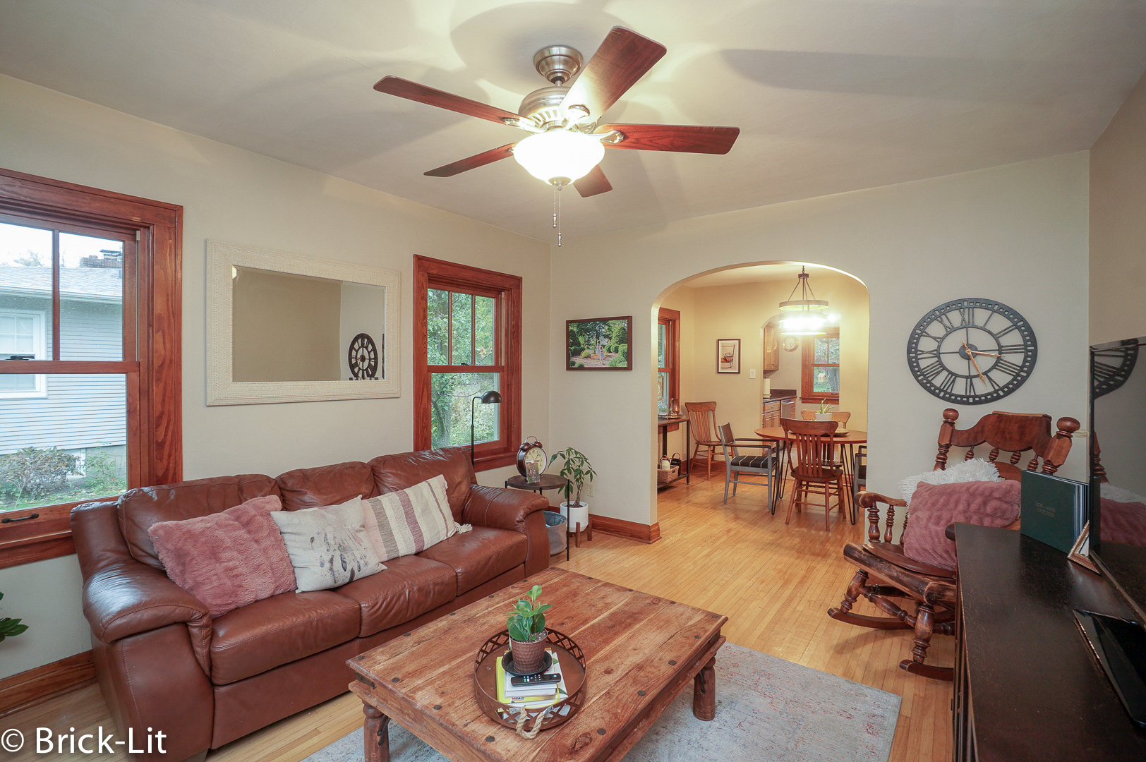 211 Gum Street New Lenox, IL 60451 - Photo 5 of 23 a living room with furniture a large window and a clock
