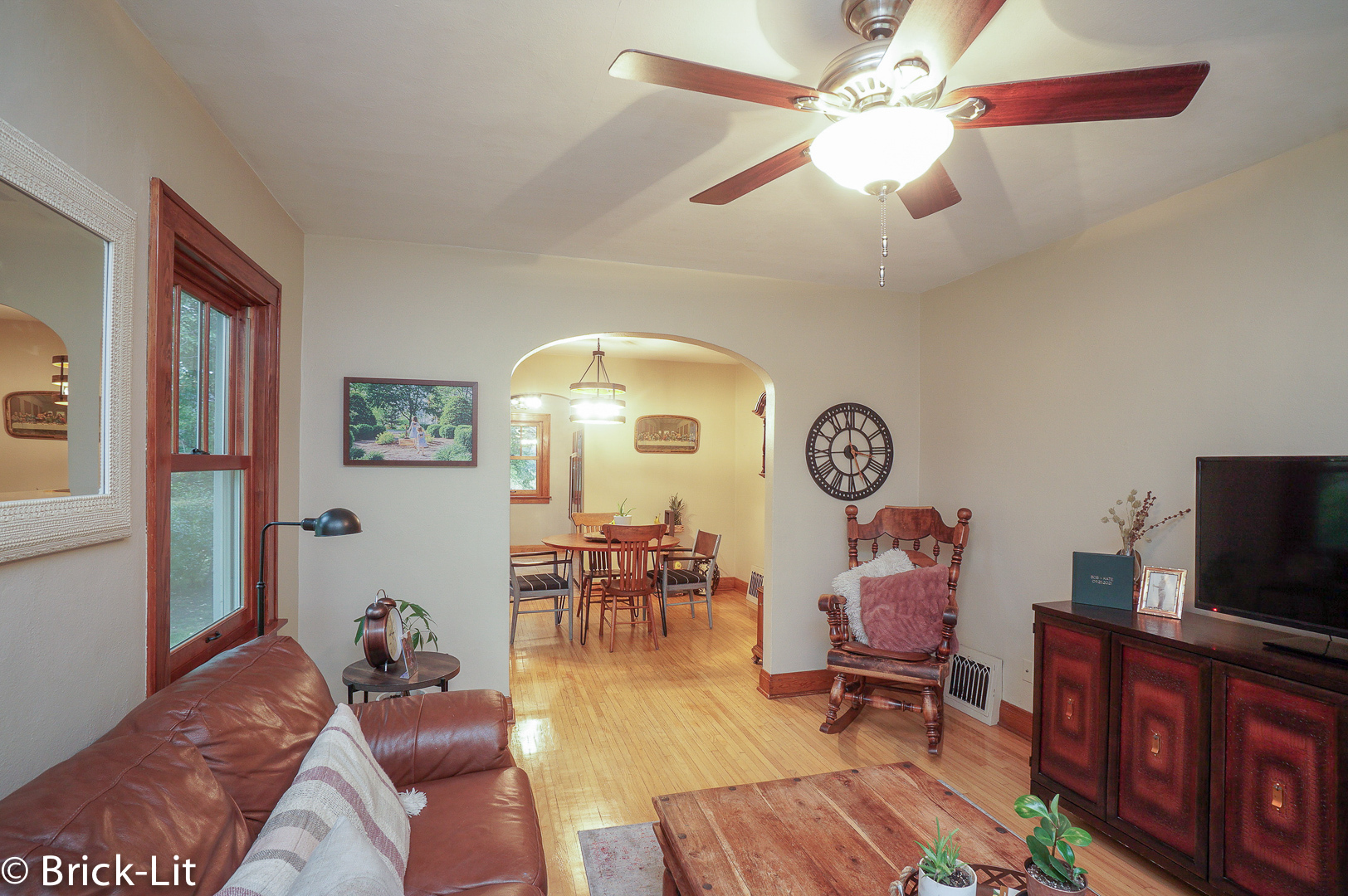 211 Gum Street New Lenox, IL 60451 - Photo 6 of 23 a living room with furniture a clock and a flat screen tv