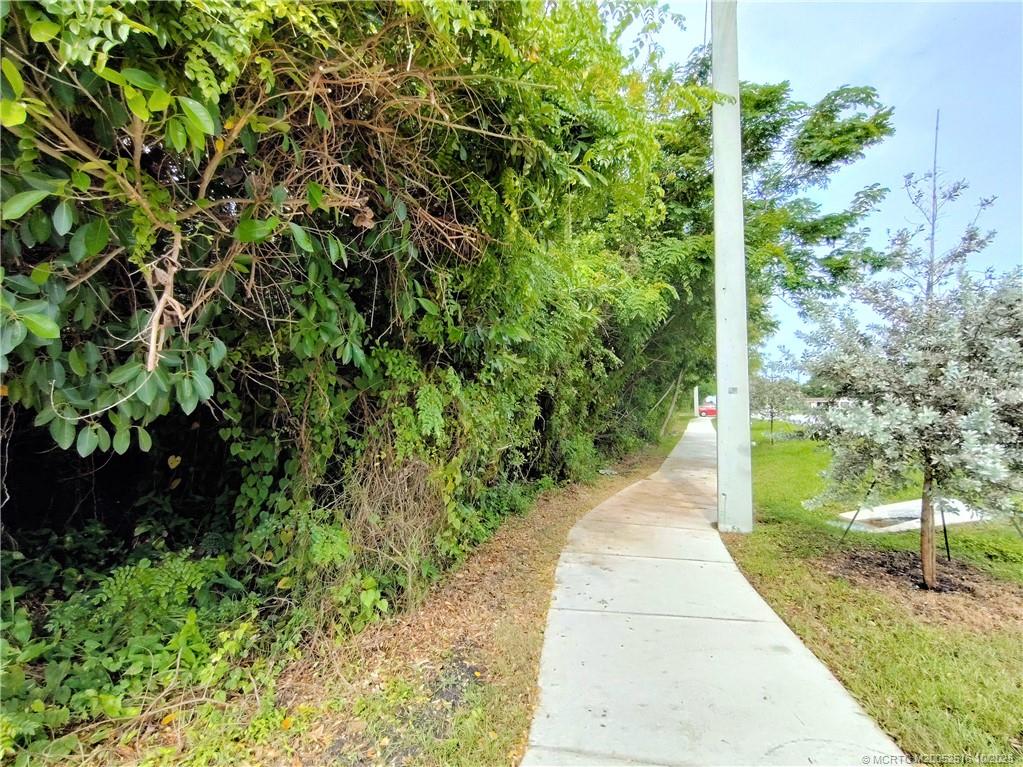 5470 Southeast Ebbtide Avenue Stuart, FL 34997 - Photo 31 of 40 a view of a garden with pathway