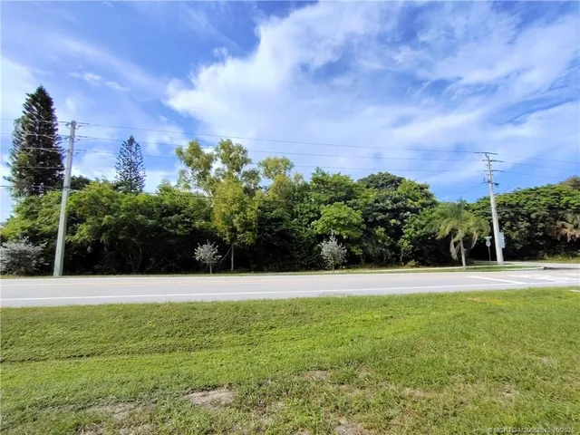 a view of a garden with a building in the background