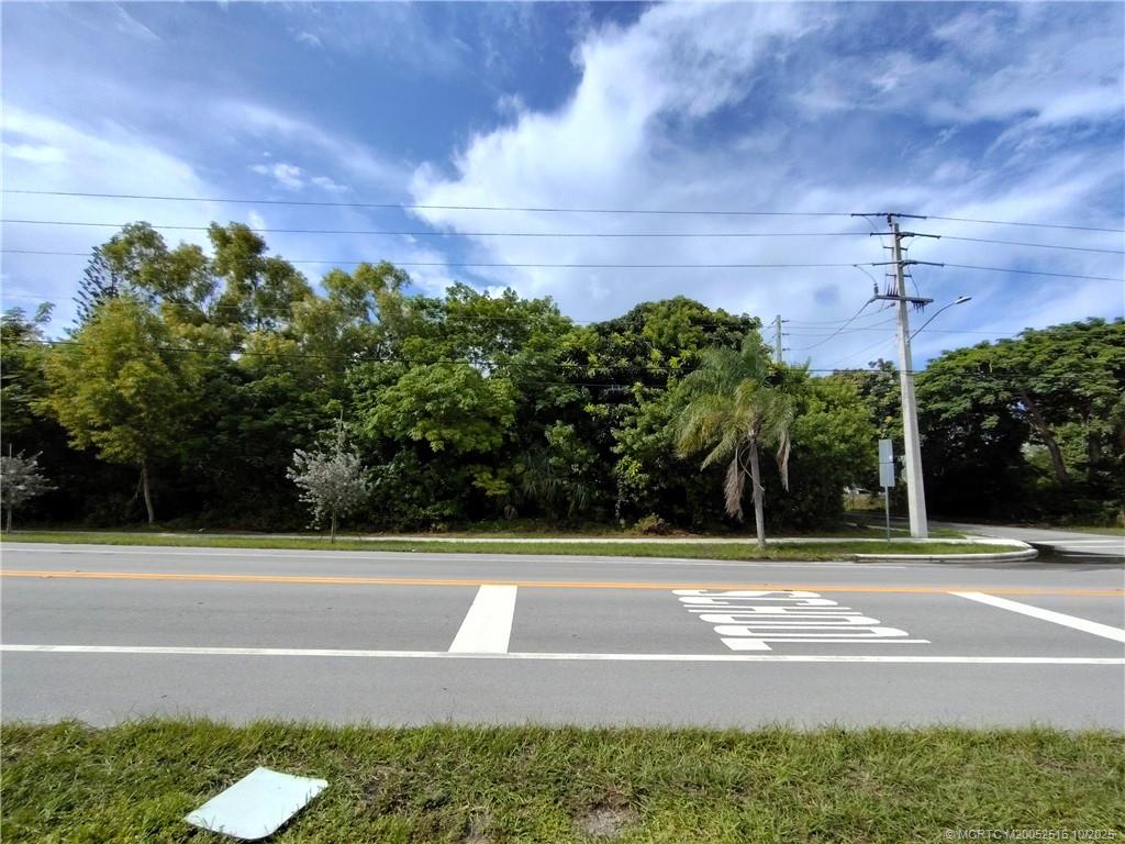 5470 Southeast Ebbtide Avenue Stuart, FL 34997 - Photo 9 of 40 a view of a swimming pool and a yard